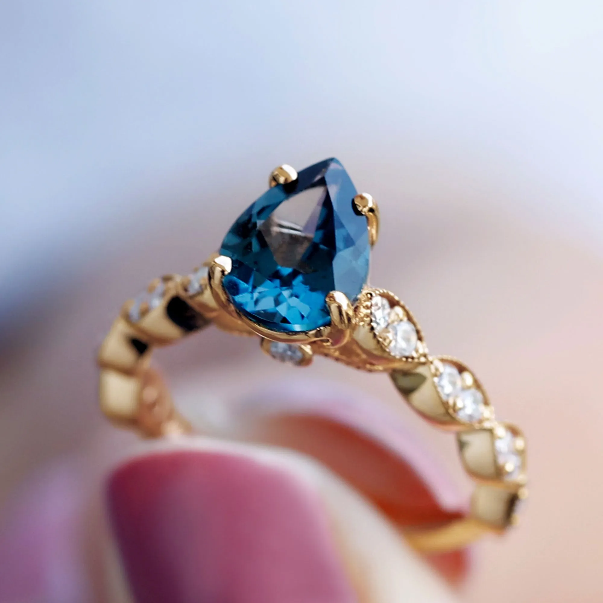 Pear Cut London Blue Topaz Solitaire Ring with Diamond Side Stones