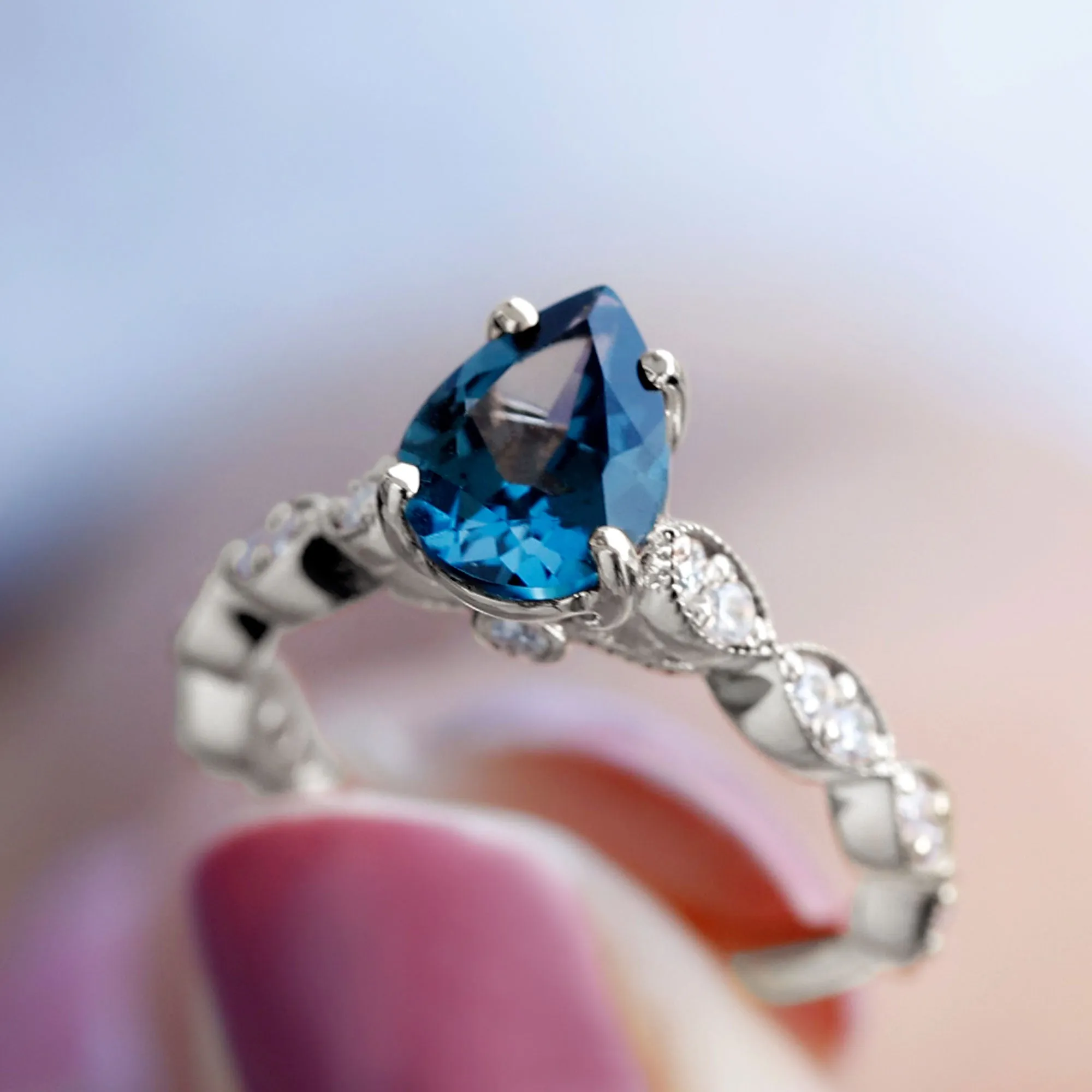 Pear Cut London Blue Topaz Solitaire Ring with Diamond Side Stones