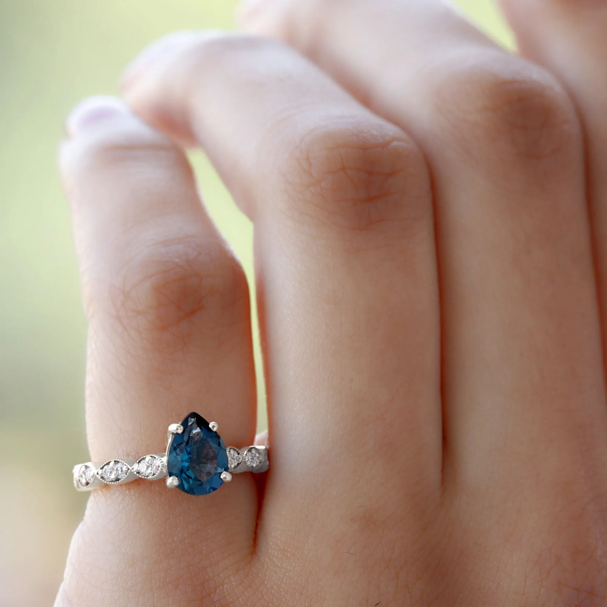 Pear Cut London Blue Topaz Solitaire Ring with Diamond Side Stones